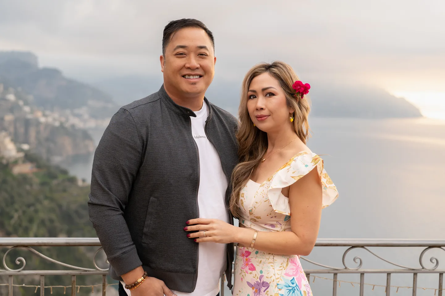 A close portrait of the couple above the sea