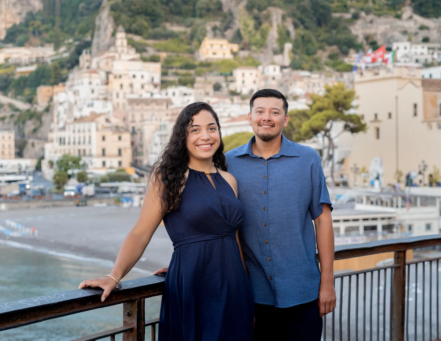Esmeralda and her companion at the railing overlooking Amalfi