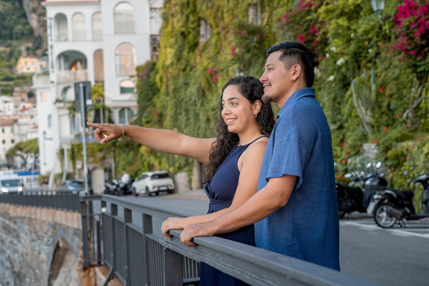Esmeralda pointing across the coast from the waterfront railing