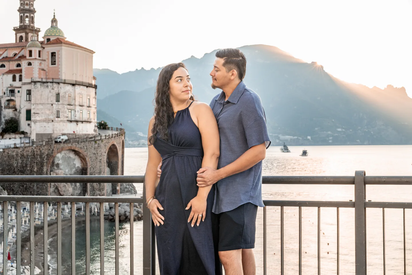 Esmeralda looking at her companion with Atrani’s church behind them