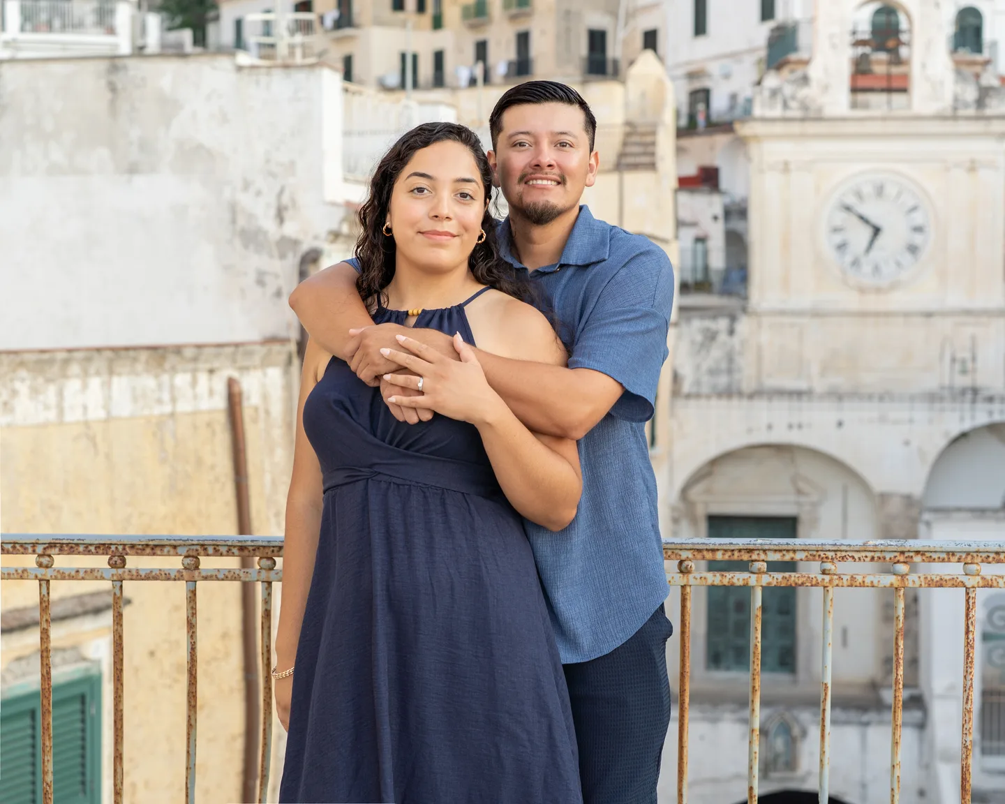 An embrace in front of Atrani’s clock tower