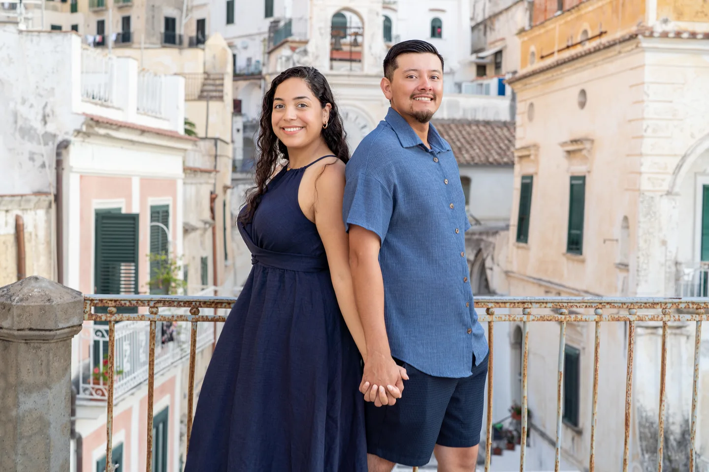 The couple standing back to back above Atrani’s square