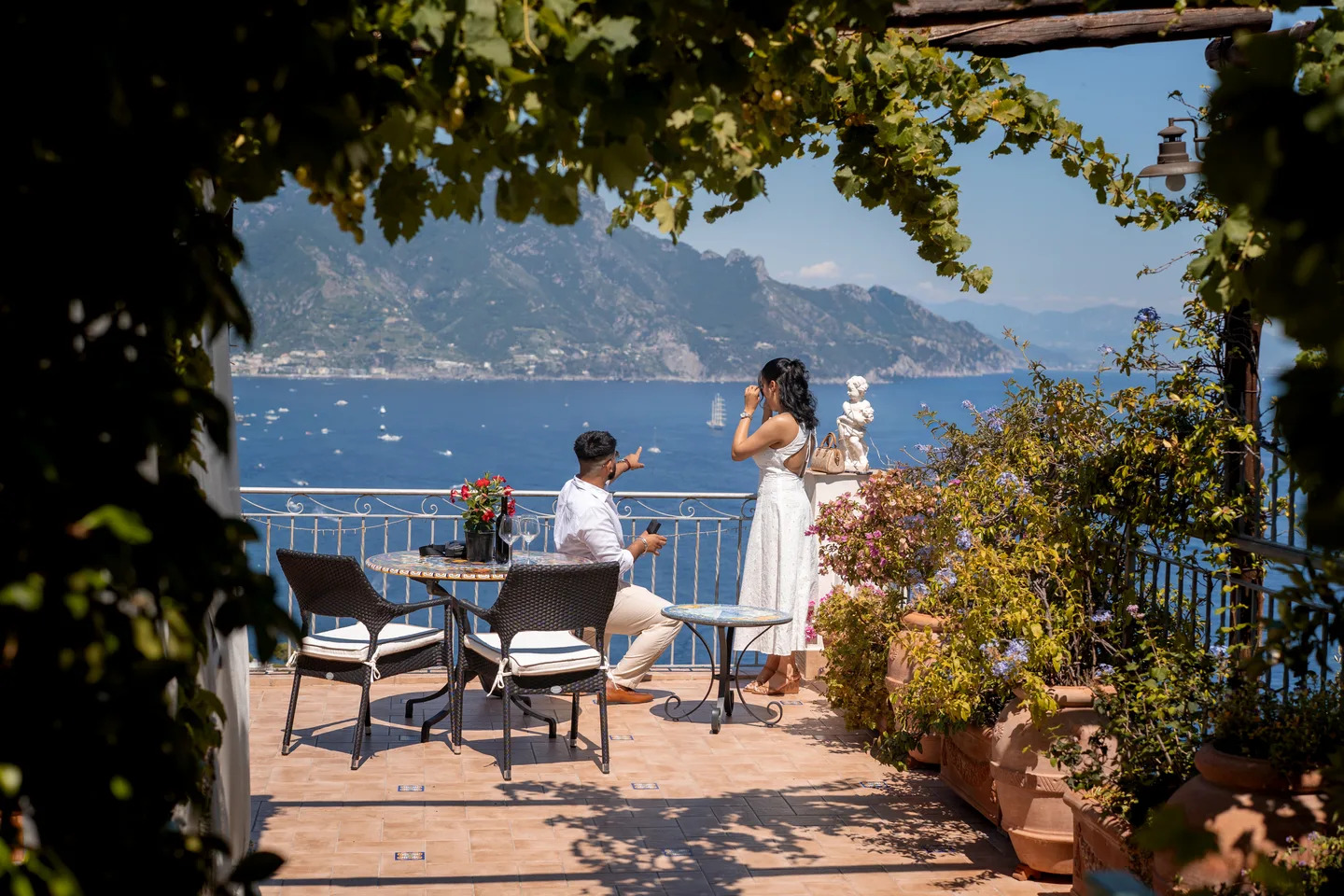 The proposal framed by the garden and sea