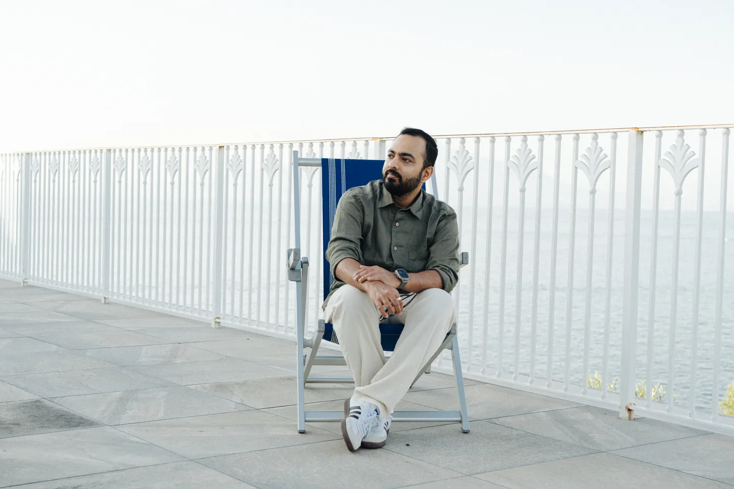 Jatin looking out from a chair on the terrace