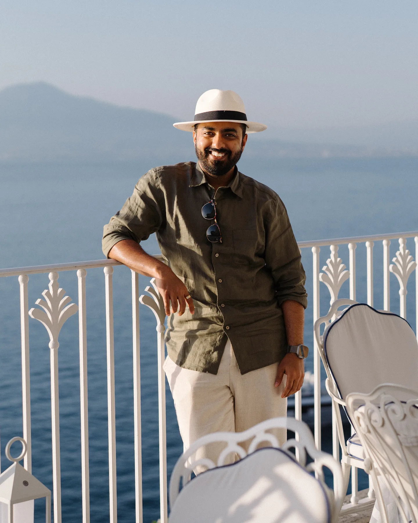 Jatin wearing a hat on the sea-view terrace