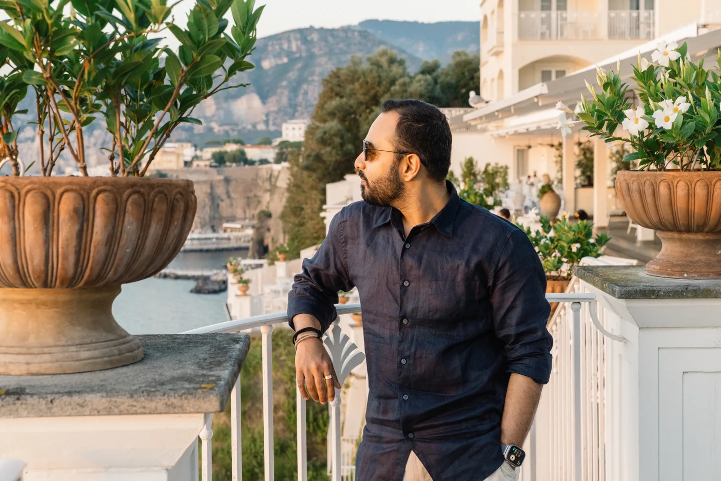 Jatin seated beside a tree on the terrace