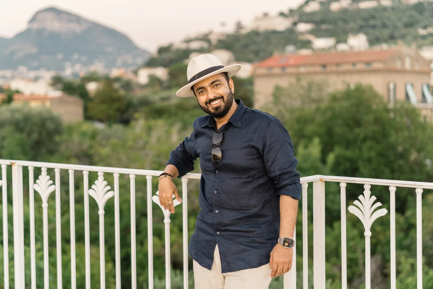 Jatin smiling in his hat above Sorrento