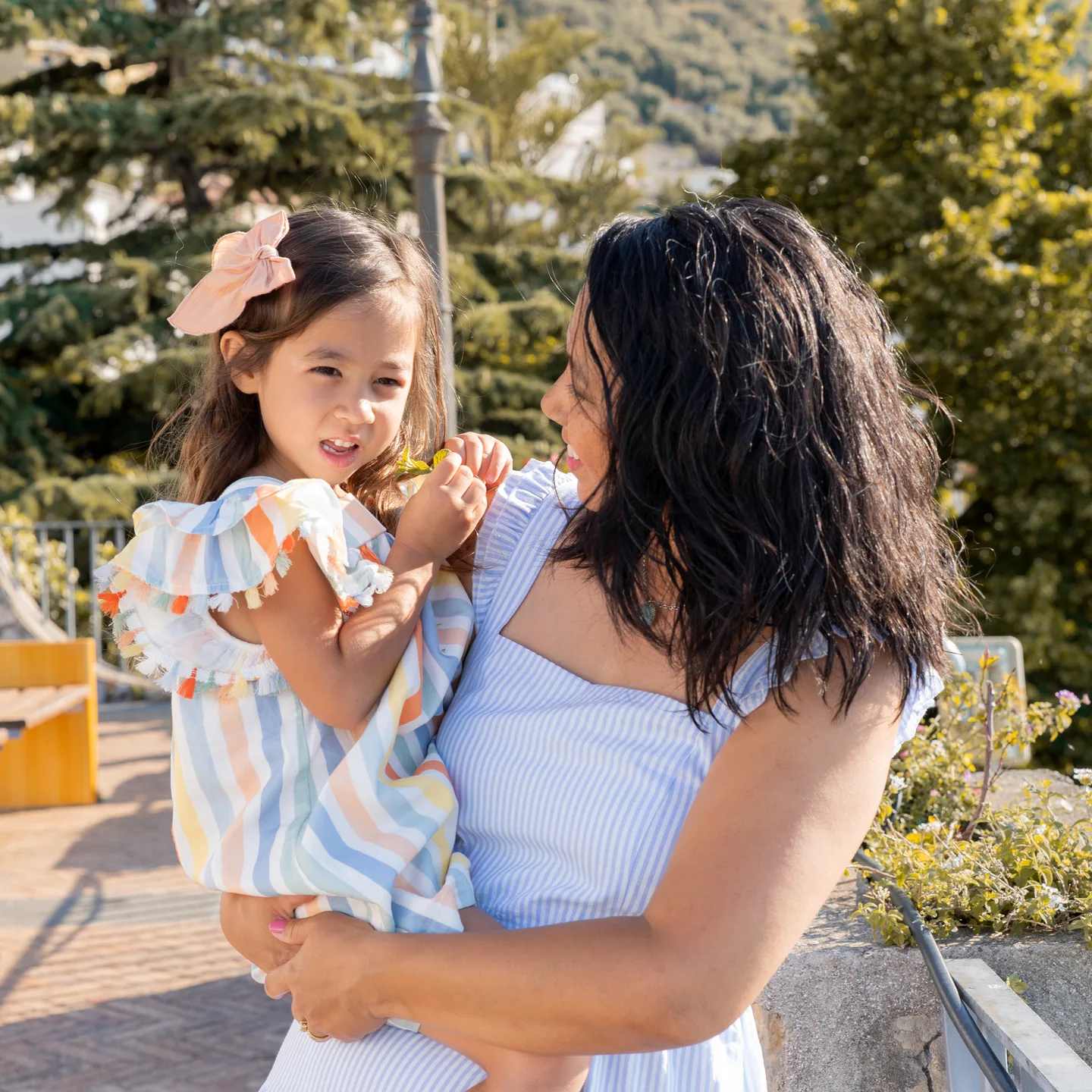 Mother and daughter sharing a moment in the village