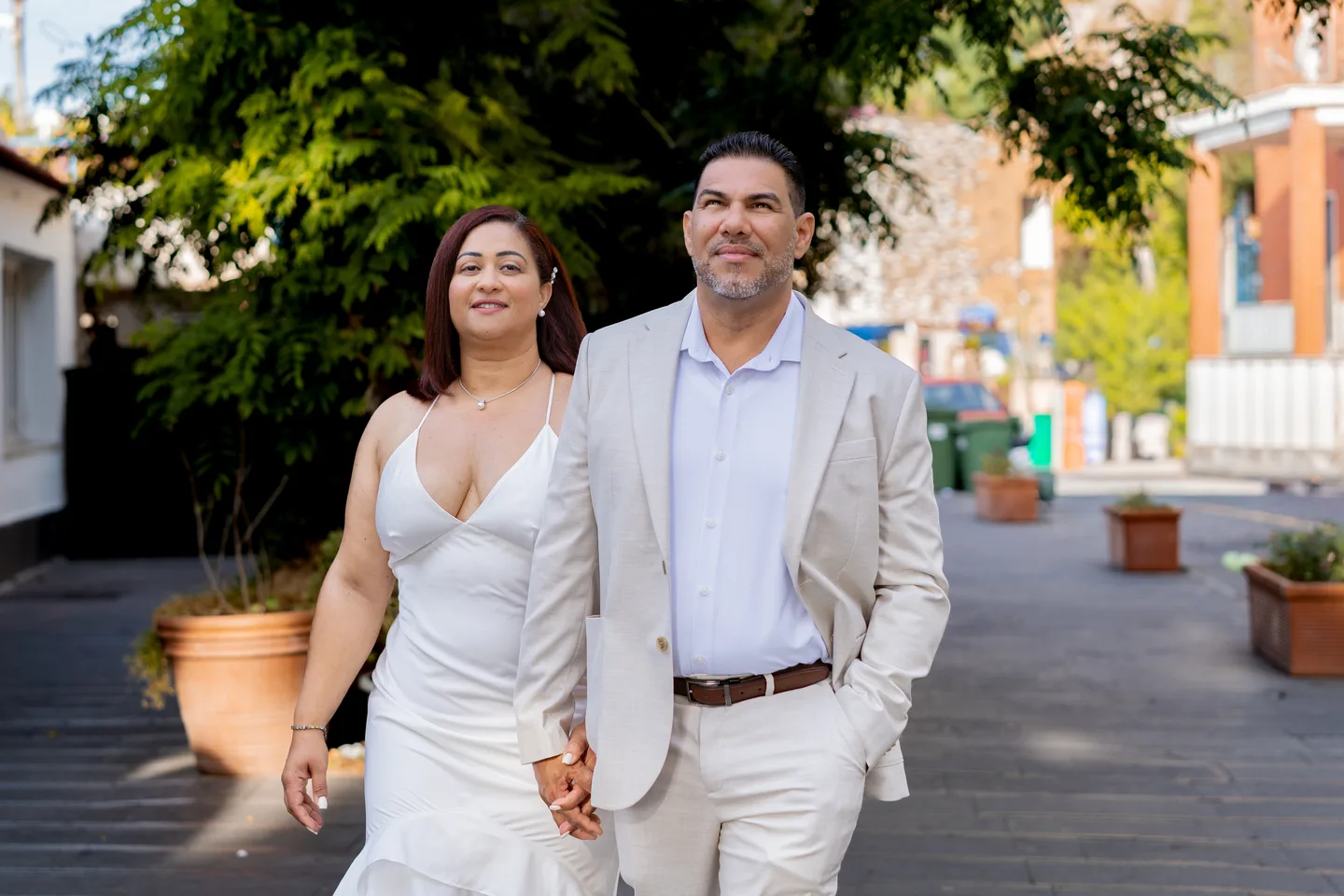 The couple holding hands on the morning promenade