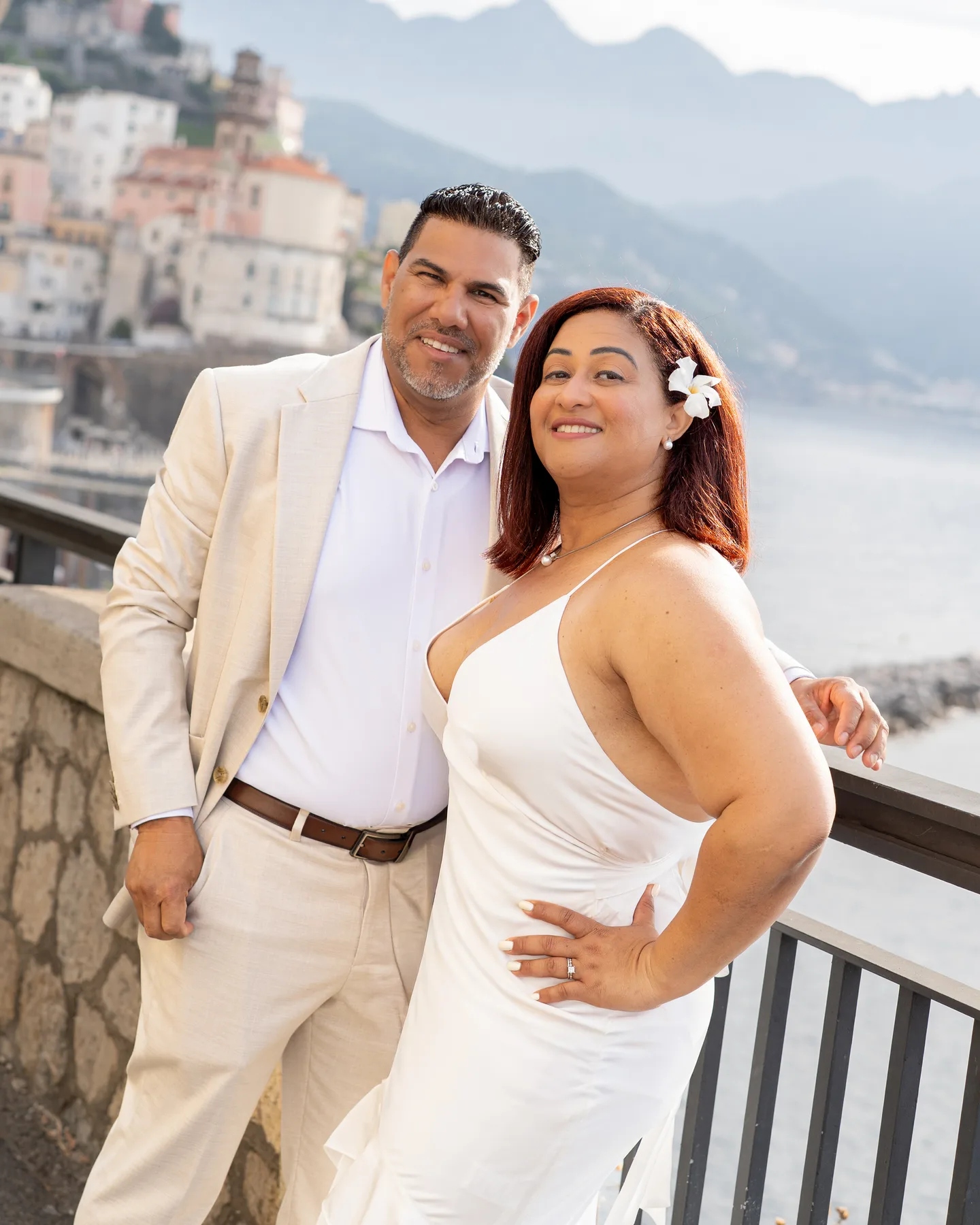Nilsa and her husband leaning together above the village