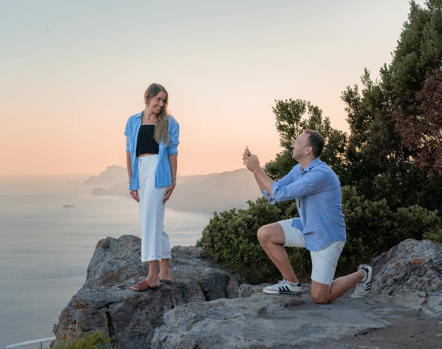 Renaud holding his partner’s hand during the proposal portraits