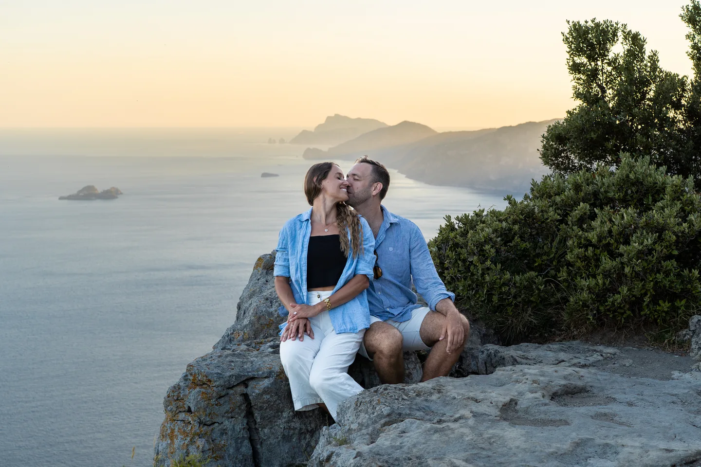 A kiss above the sea in the evening light