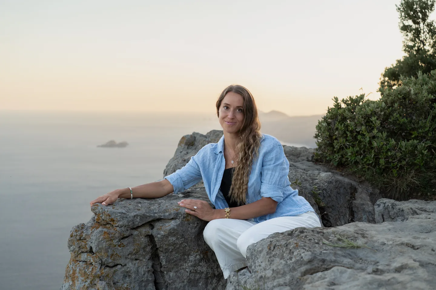 A seated portrait at the mountain viewpoint