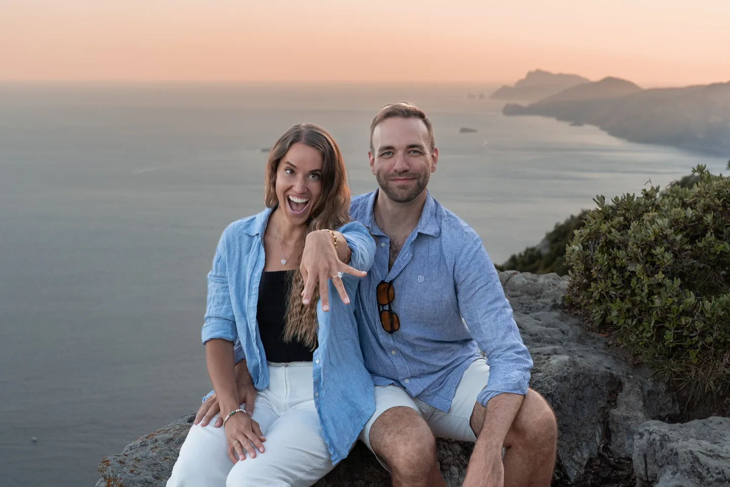 The couple smiling in the soft evening light