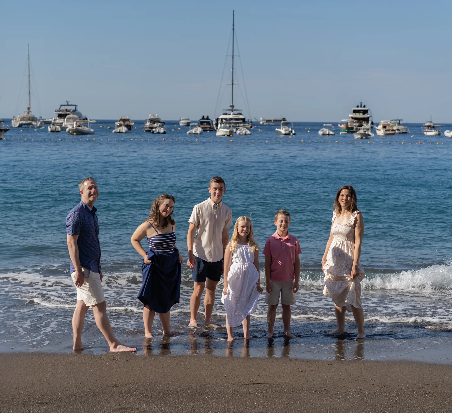 The family walking out of the water together
