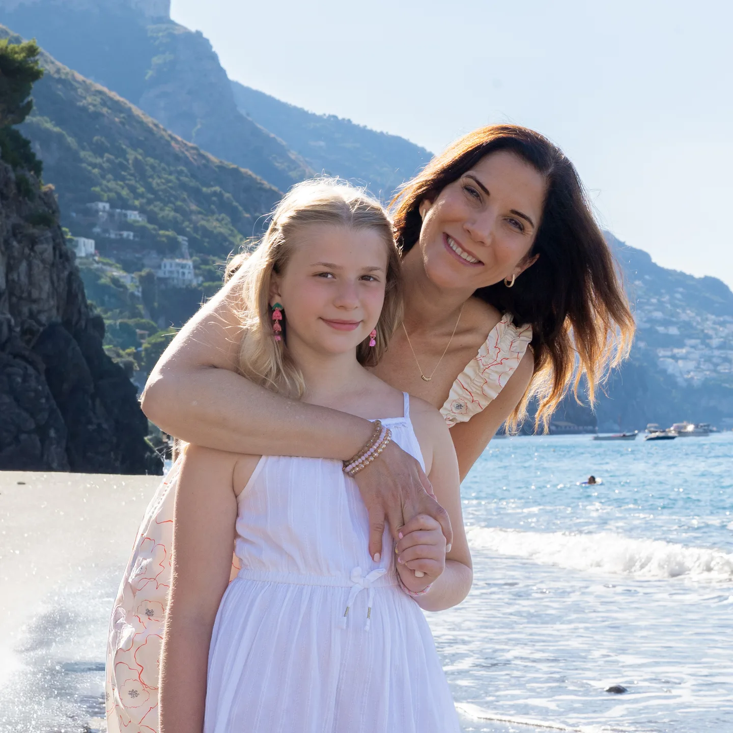 A mother and daughter portrait beside the sea