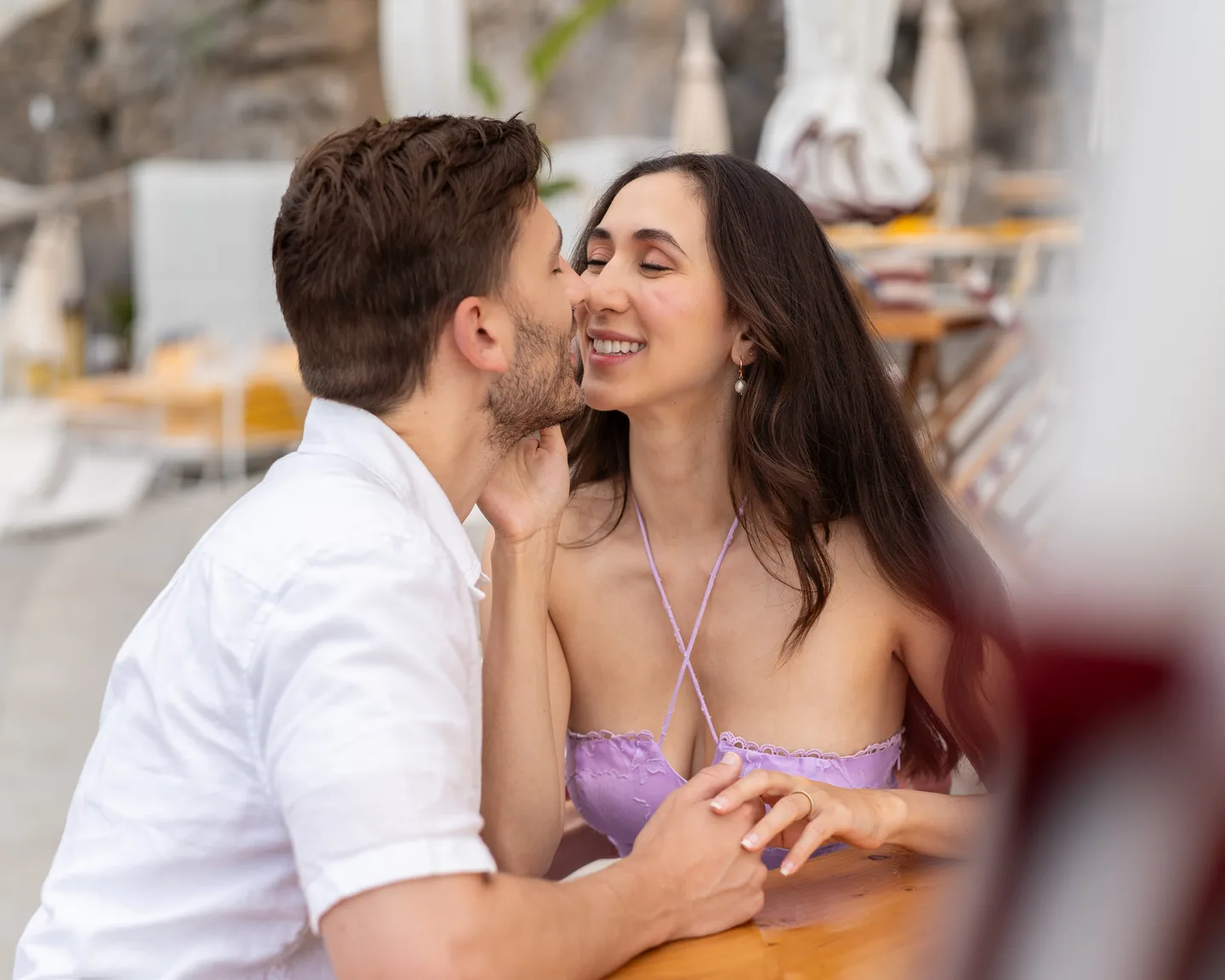 A close portrait of the couple sharing a kiss