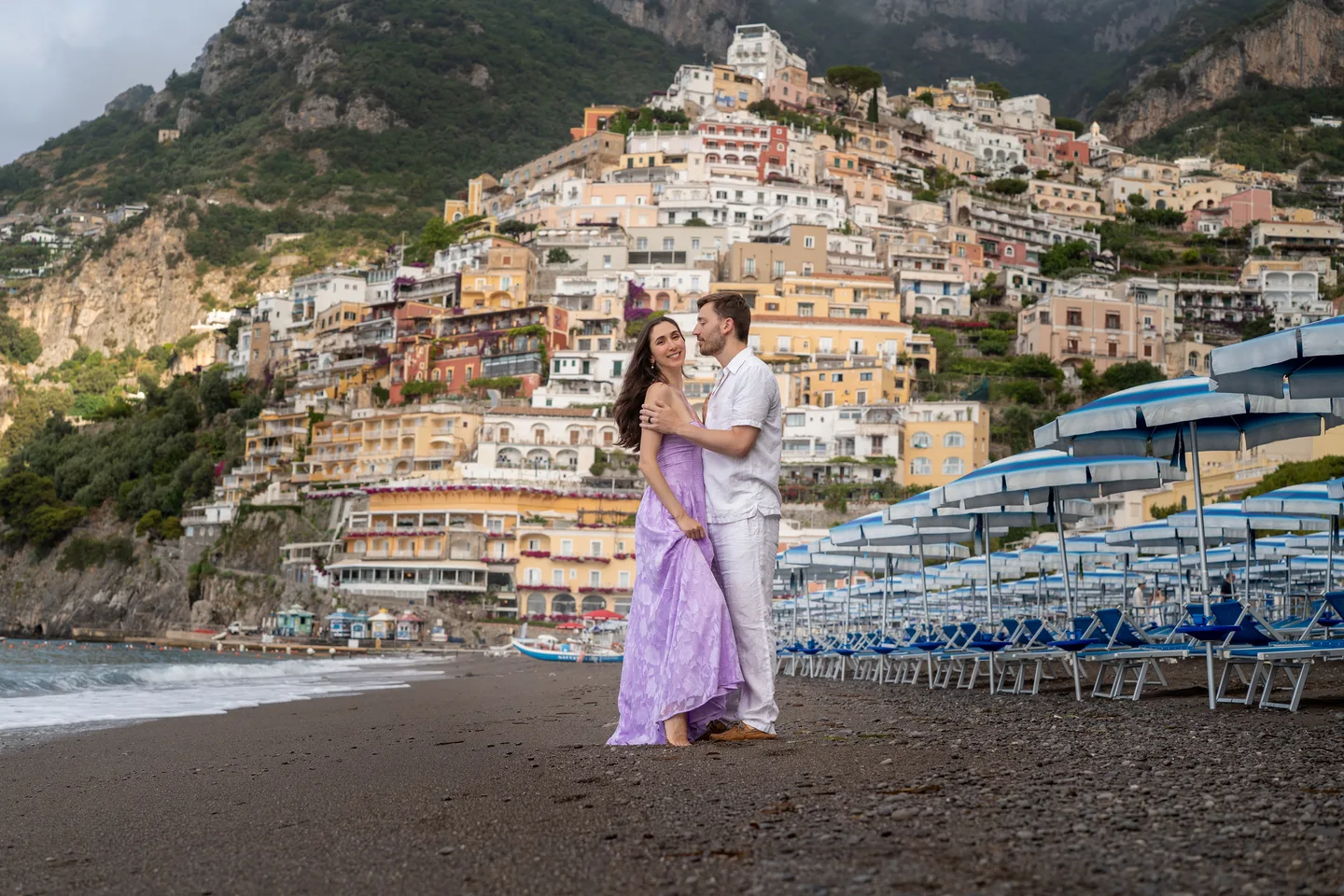 A wide view of the couple on Positano beach