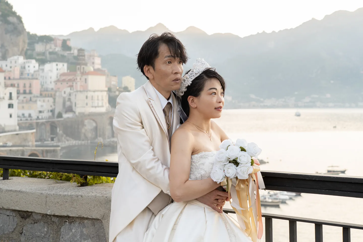 The couple smiling together against the mountain backdrop