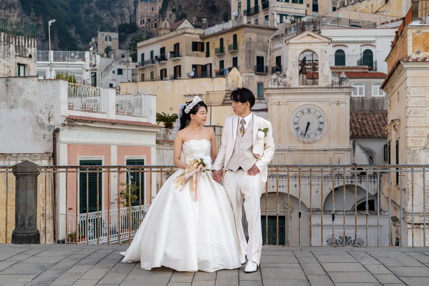 The couple beside the railing above Atrani’s square