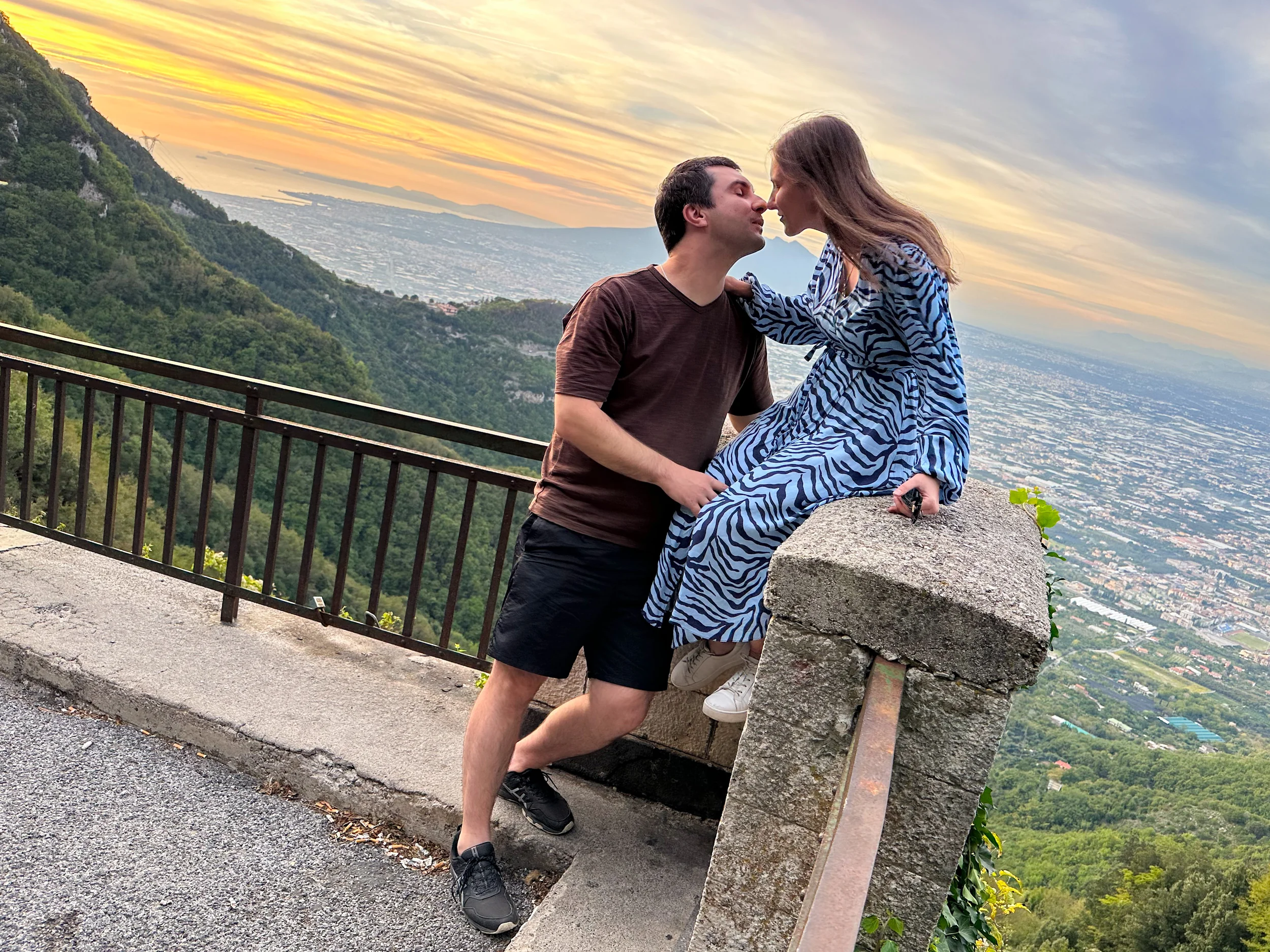 Couple at a scenic overlook in the Tramonti mountains at sunset