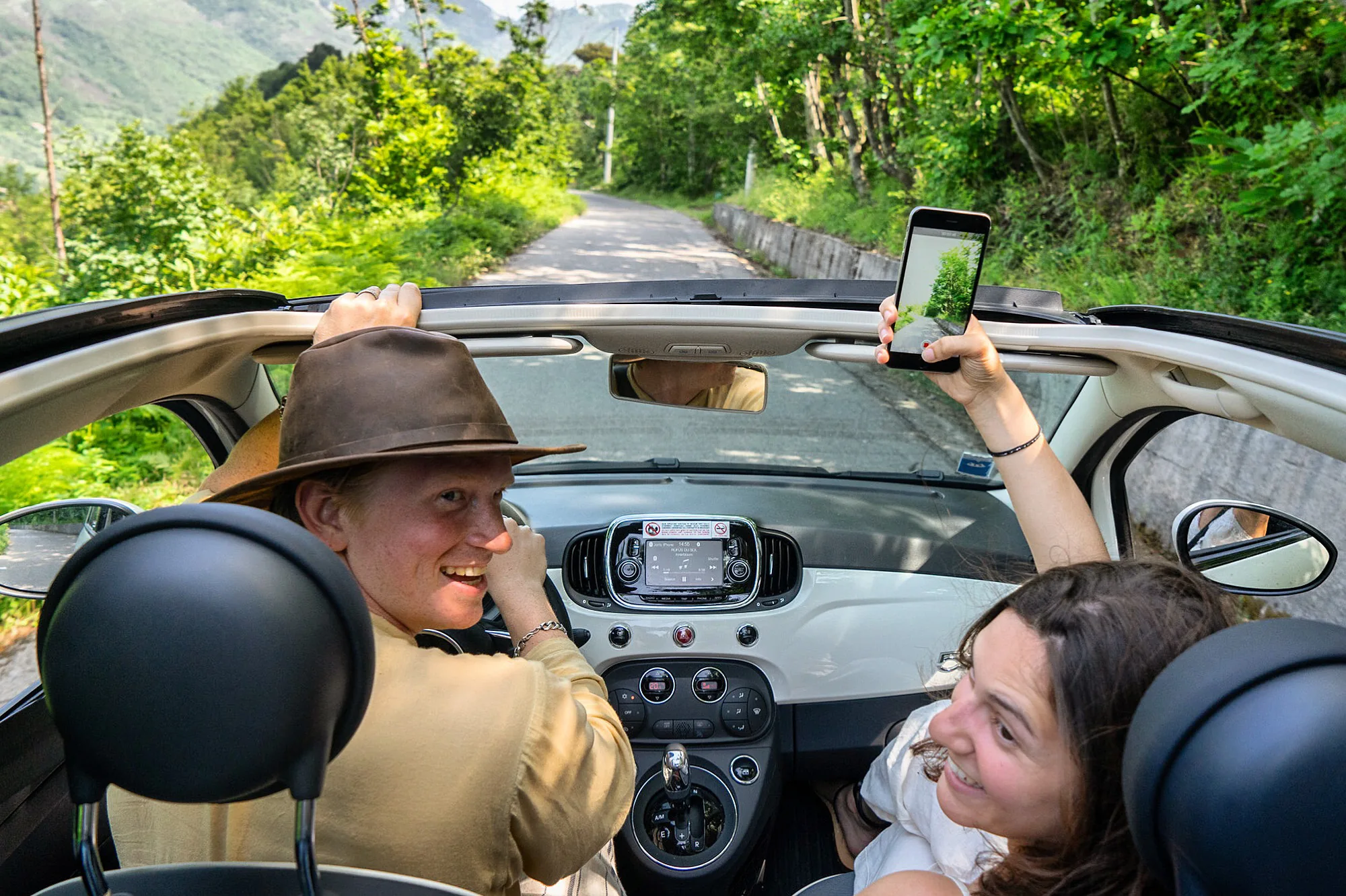 Riding in a convertible on a mountain road